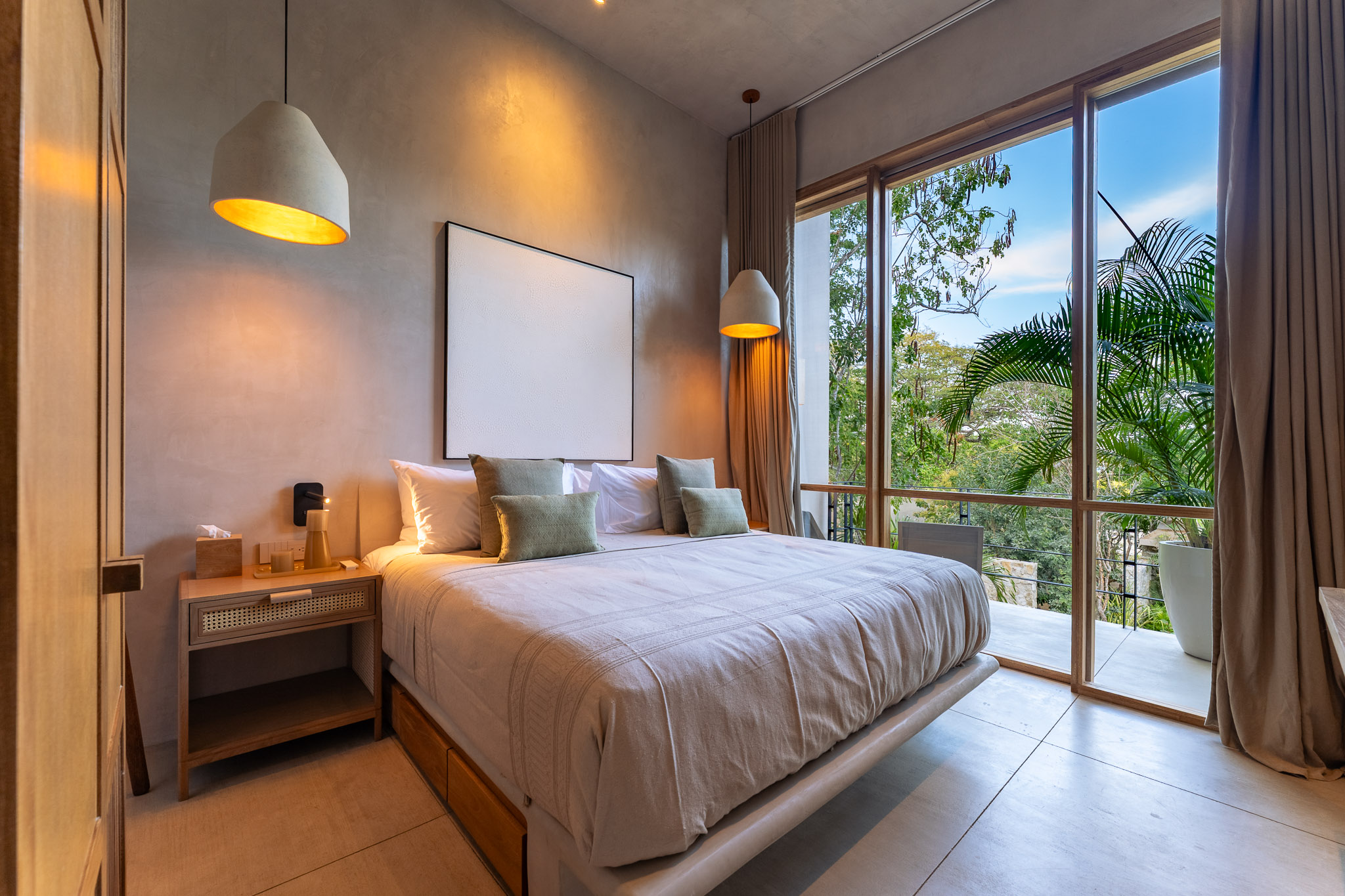 Bedroom with large windows and terrace